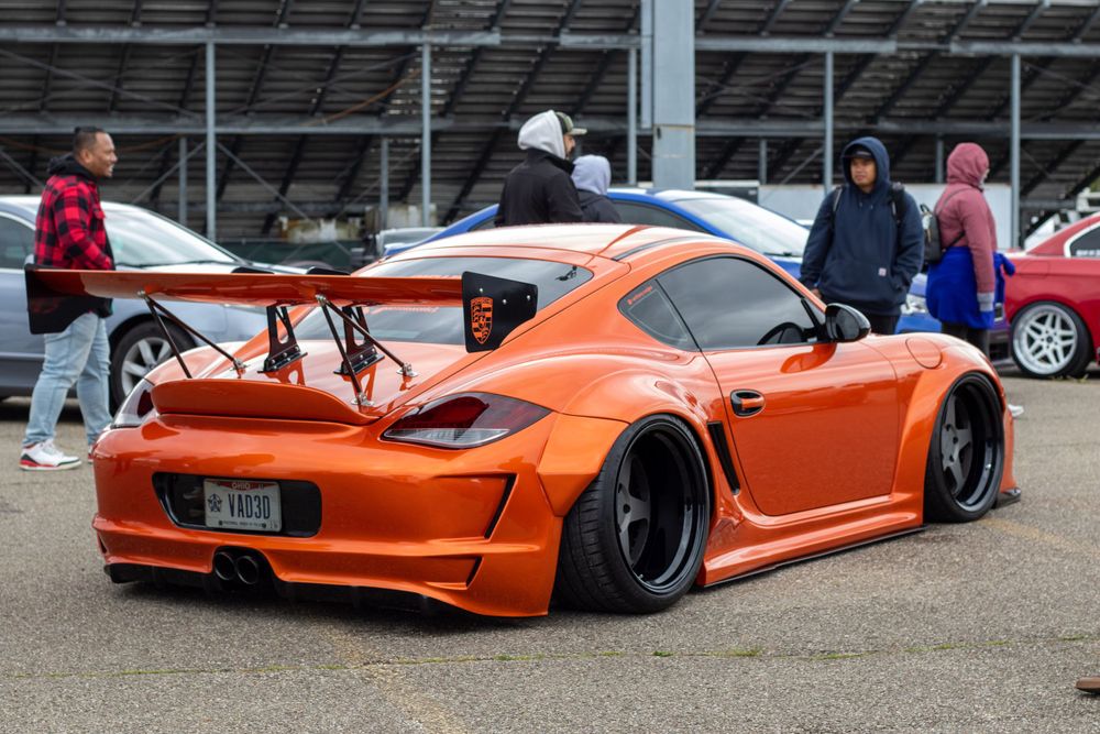 Orange porsche car with large rear wing