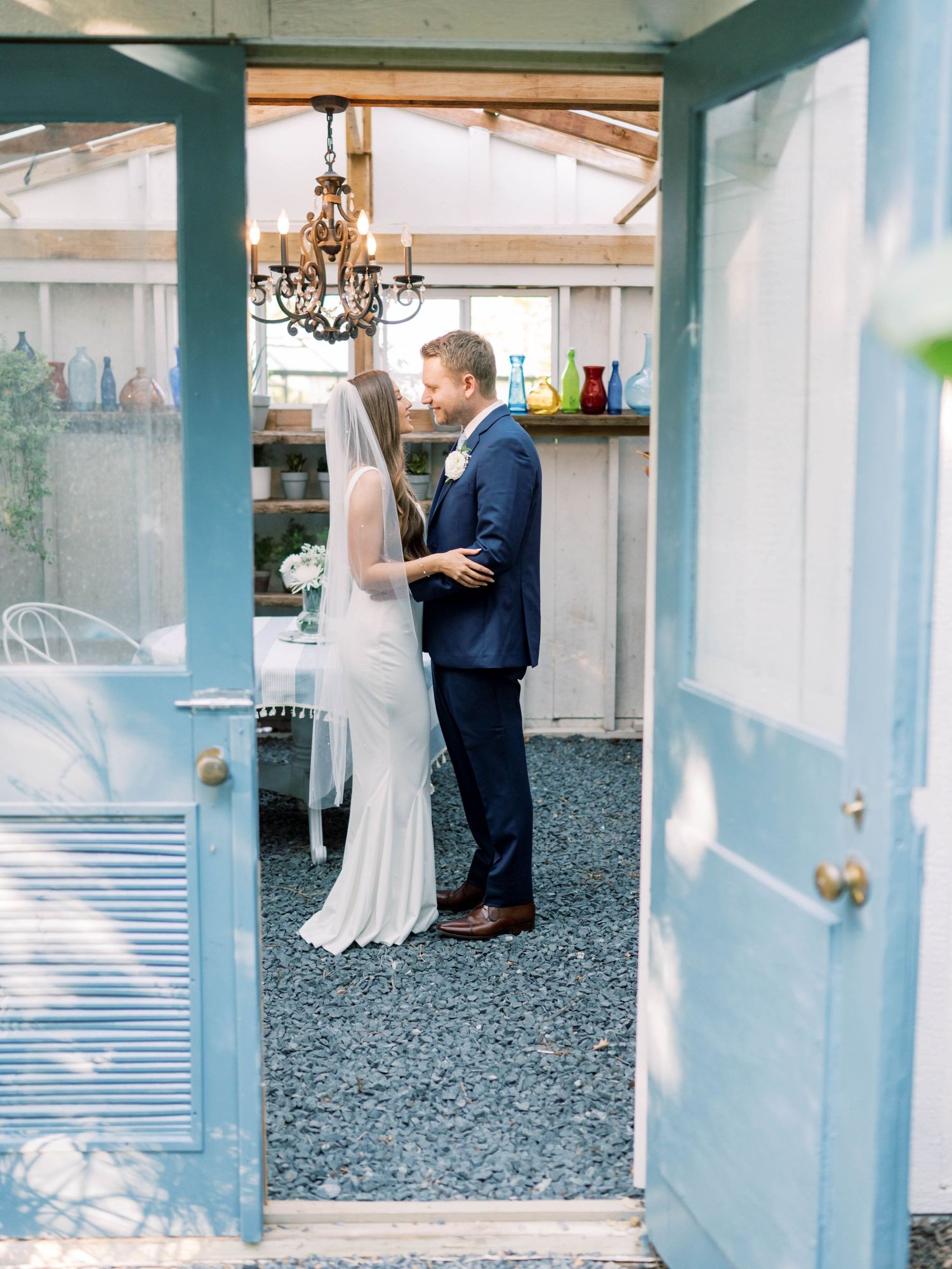 wedding photo of a couple dancing in a greenhouse