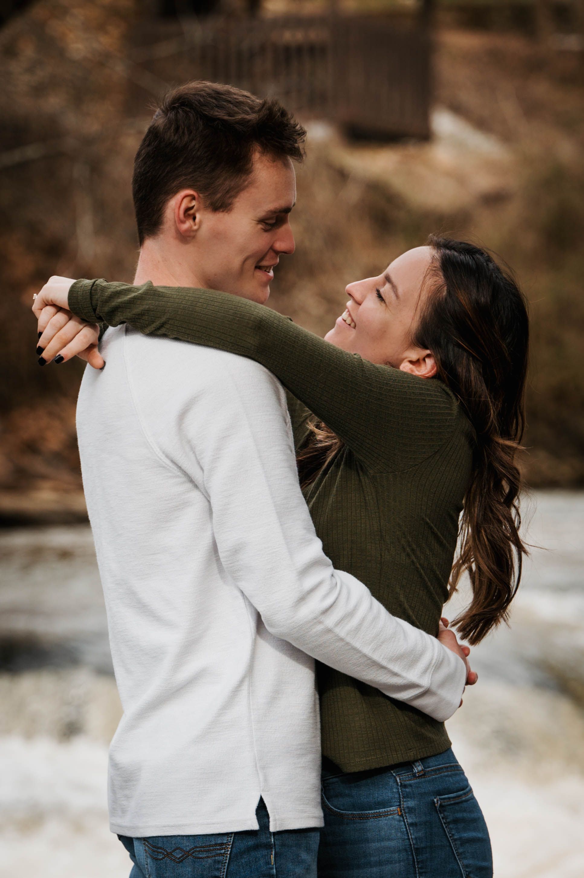 Intimate couples photoshoot showing emotional connection in outdoor setting.