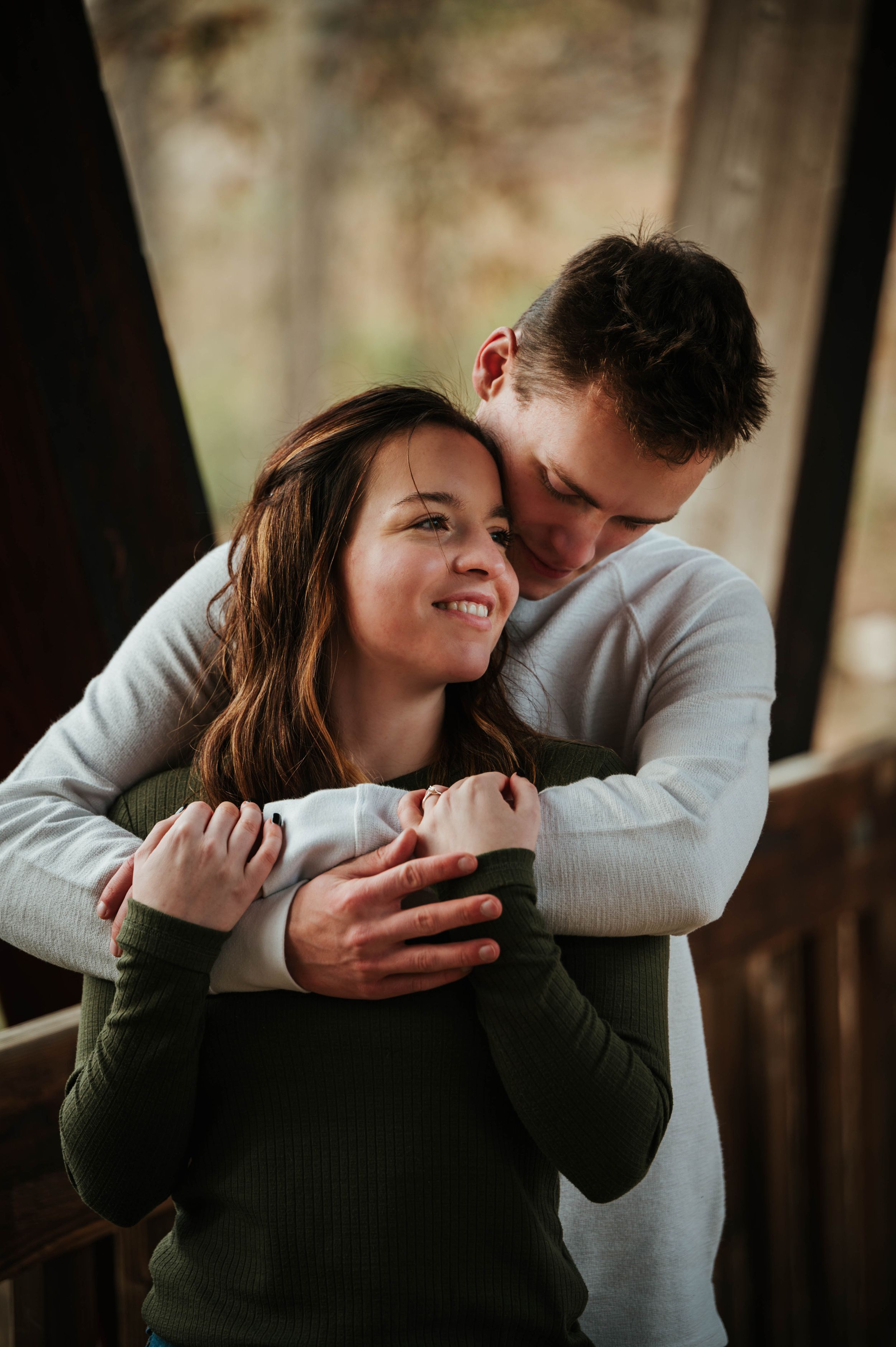 Candid romantic moment captured during outdoor couples photoshoot.