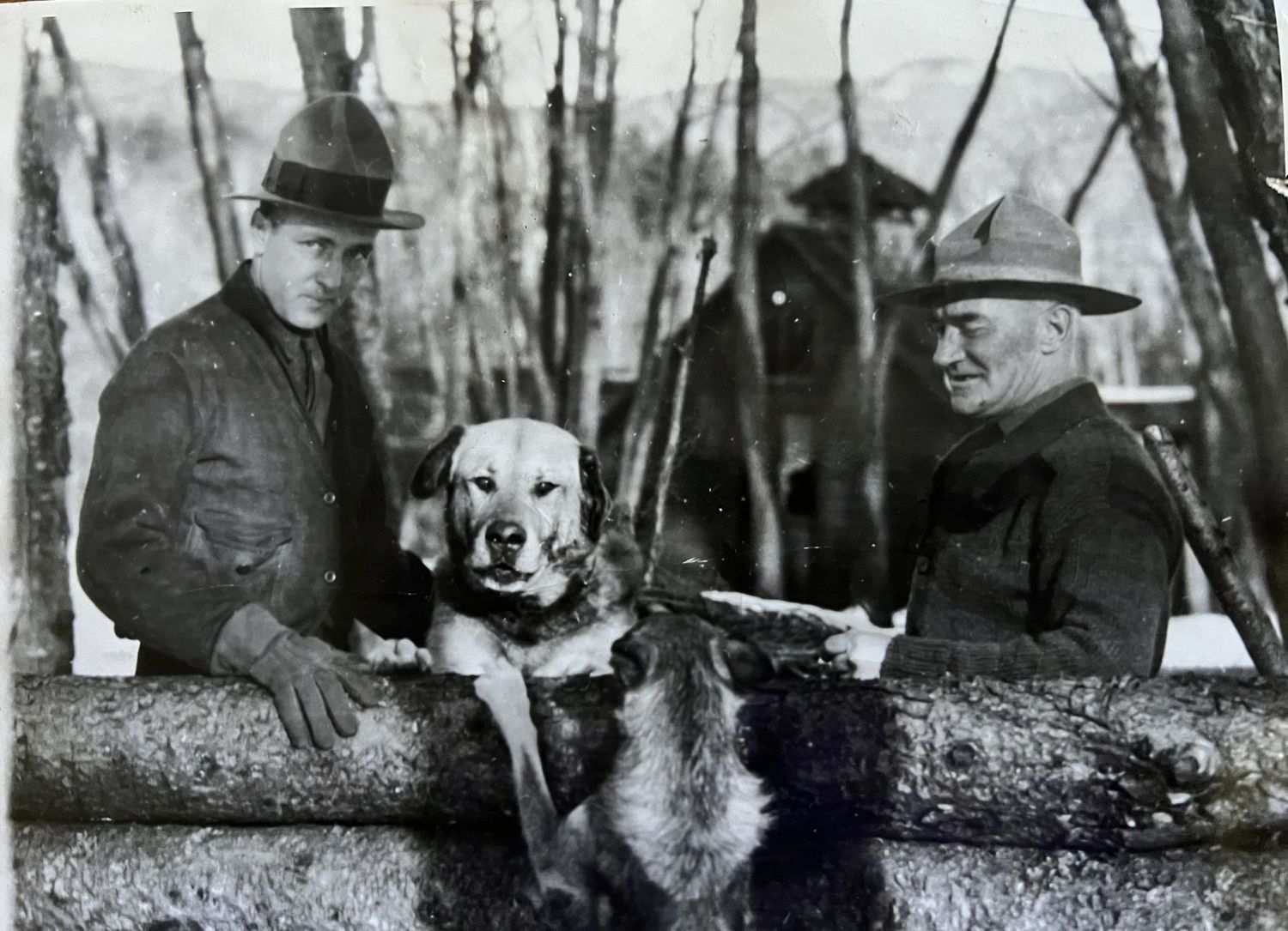 Admiral Richard E. Byrd poses with Arthur Walden and lead dog Chinook in New Hampshire.