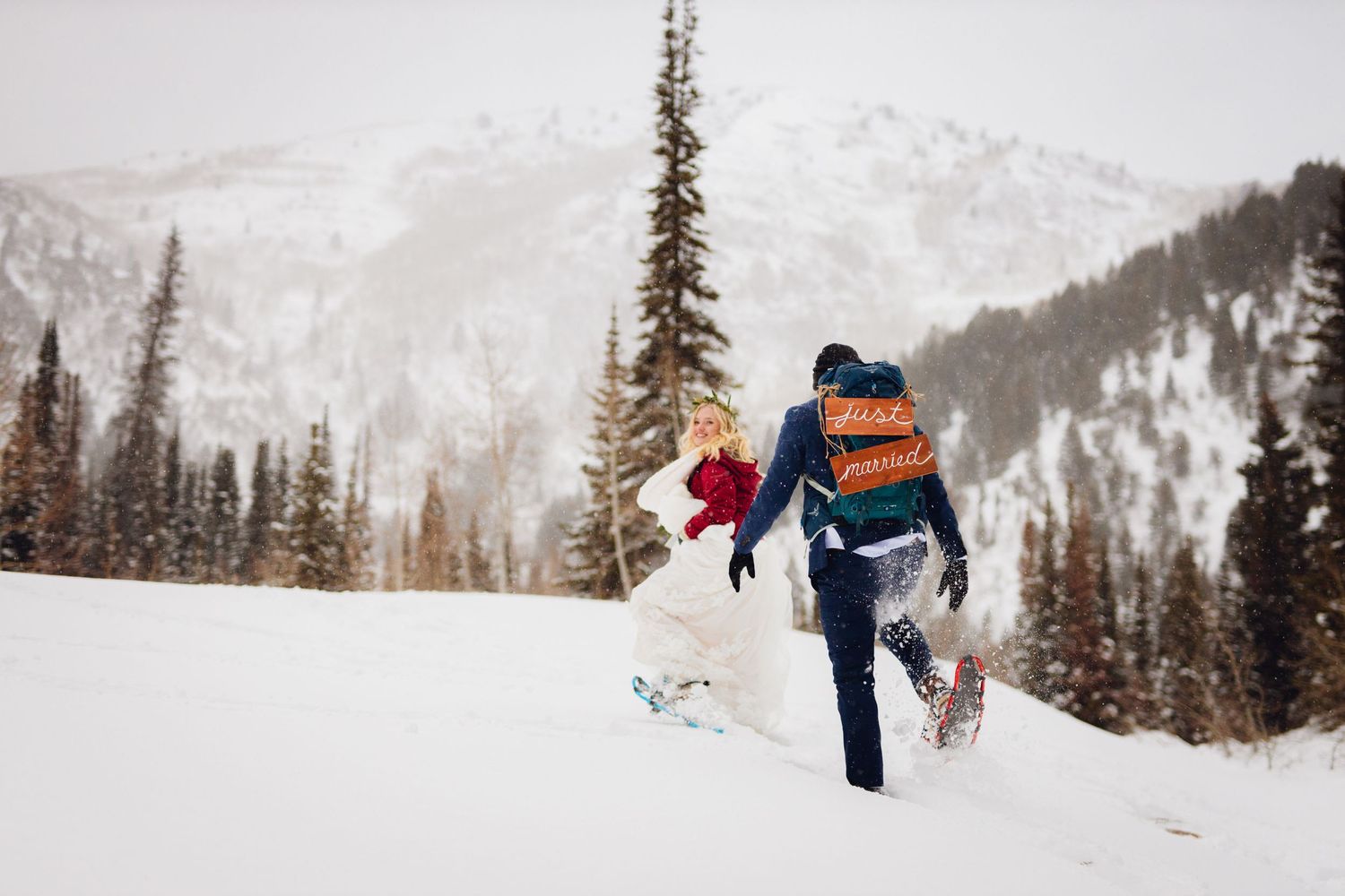 Couple Snow Shoeing on their wedding day