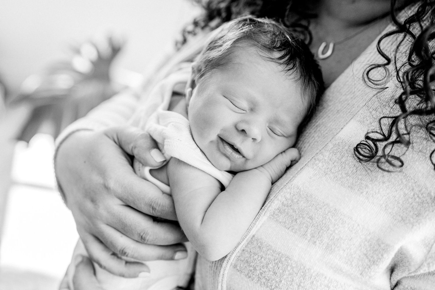newborn snuggling on mother studio baby session lifestyle photographer bellingham wa smiling baby