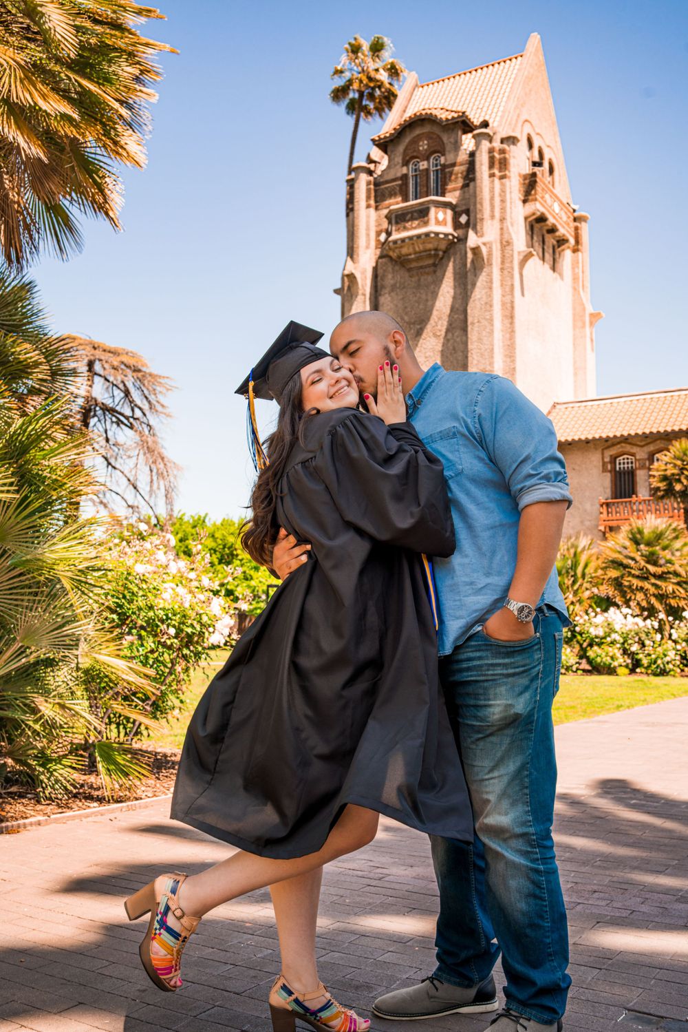 Celebrating Graduation - Happy SJSU Graduating Couple in Cap and Gown