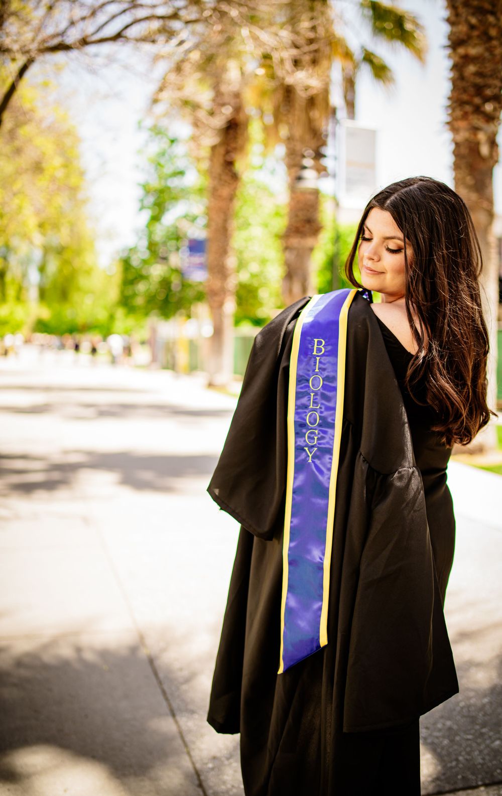 Happy San Jose State University (SJSU) Graduating Girl in Cap and Gown