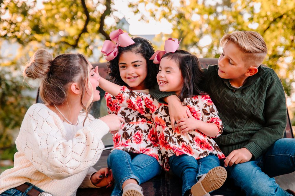 Adopted siblings on a truck at Coal Creek Farm Jenks Tulsa Broken Arrow Photographer Oklahoma
