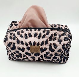 Leopard print makeup bags arranged in a row showing different views of the same design.