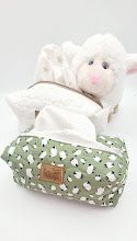 White and green floral print fabric storage pouches displayed in various positions.
