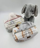 Gray and white patterned storage bags with animal designs shown from different views.