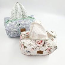 White floral print fabric pouches with delicate rose patterns displayed in sequence.