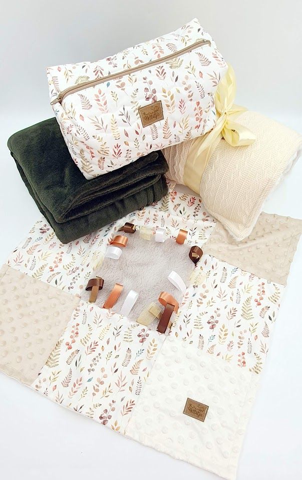Cosmetic bags in cream and forest green with delicate floral patterns shown from multiple views.