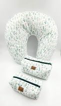 Mint green and white floral patterned nursing pillow with matching accessories.