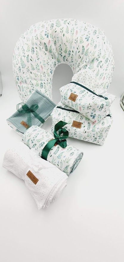 Nursing pillow set featuring delicate botanical print with green ribbon accents.