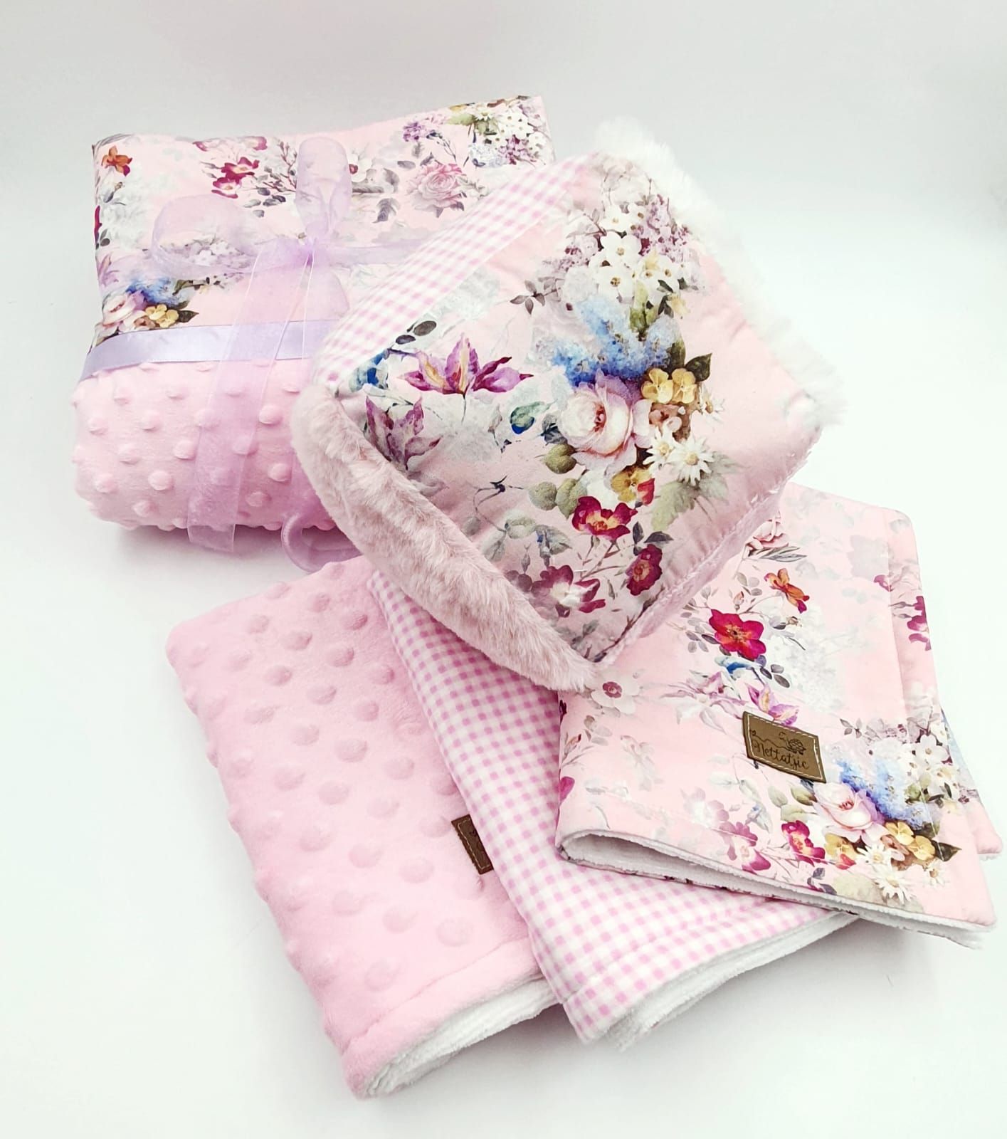 Delicate pink floral baby blankets with dotted minky texture shown from multiple views.