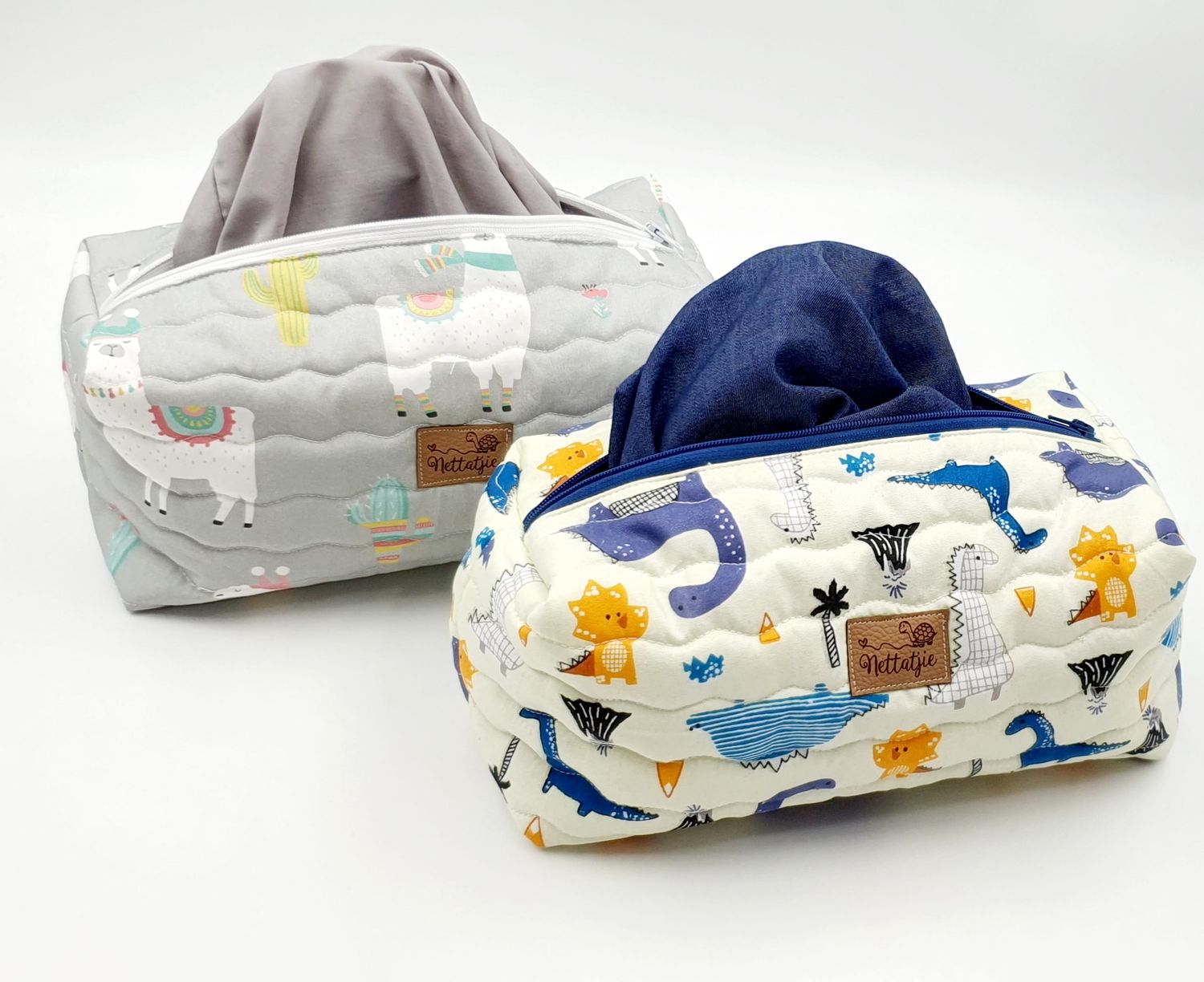 Baby accessories bag with whale pattern shown from multiple angles.