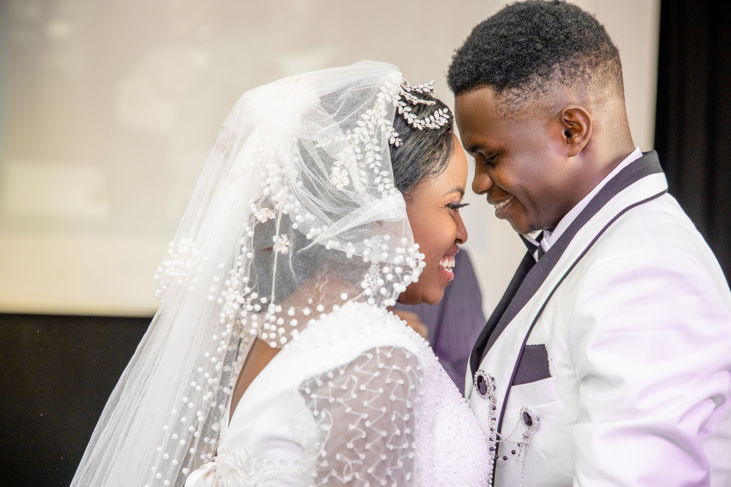 Bride and groom smile