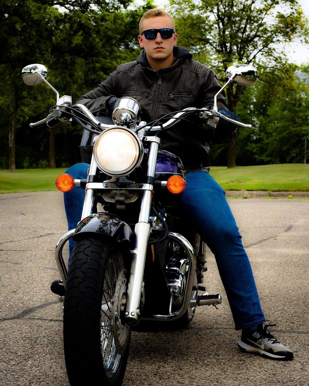Custom motorcycle front view showing chrome details and headlight.