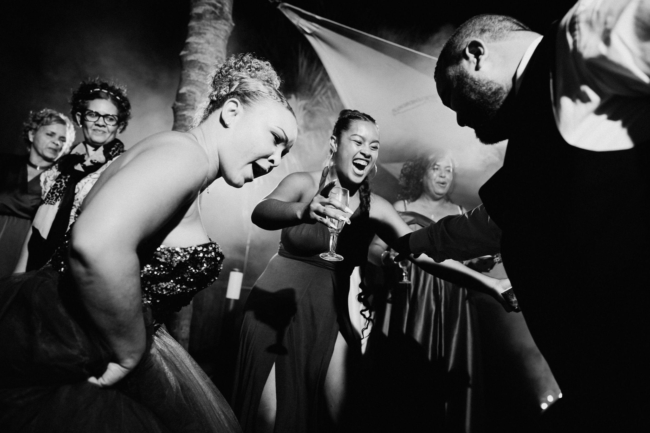 Black and white photos capturing candid moments at a celebration.