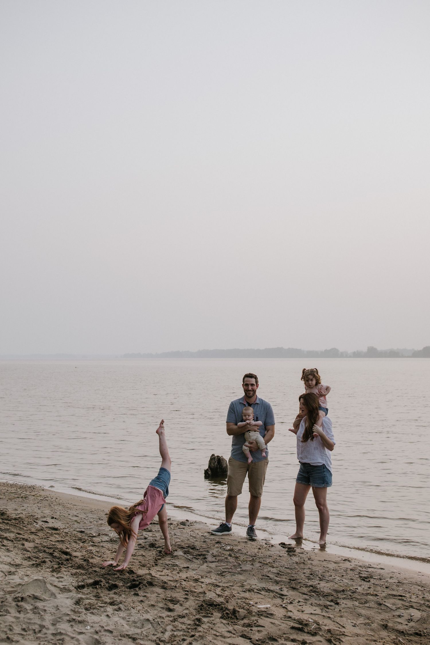 A series of candid family moments captured during sunset on a sandy beach.