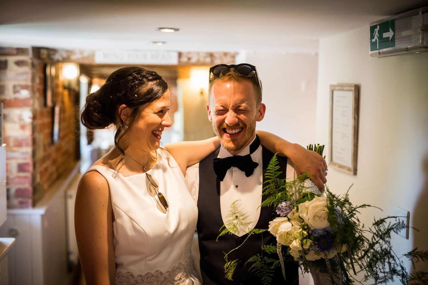 Intimate wedding preparation moments captured in a bright, modern room.