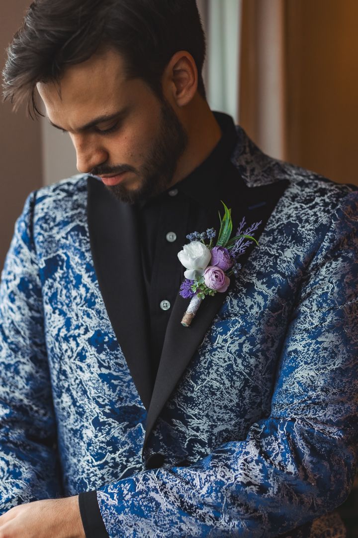 groom-getting-ready-blue-suit