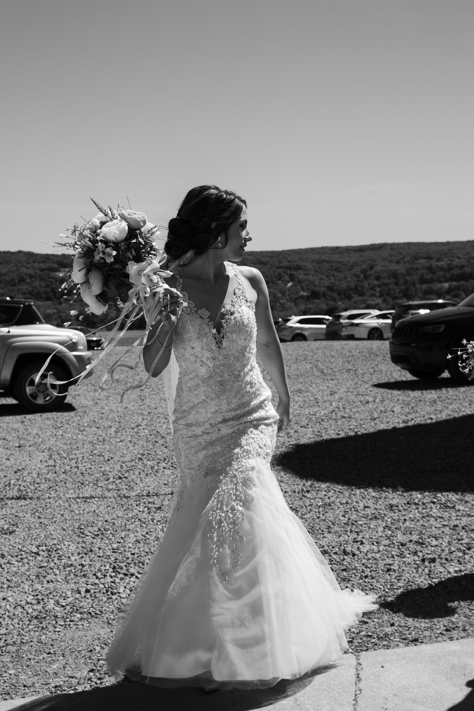 walking wedding day bride black and white gown