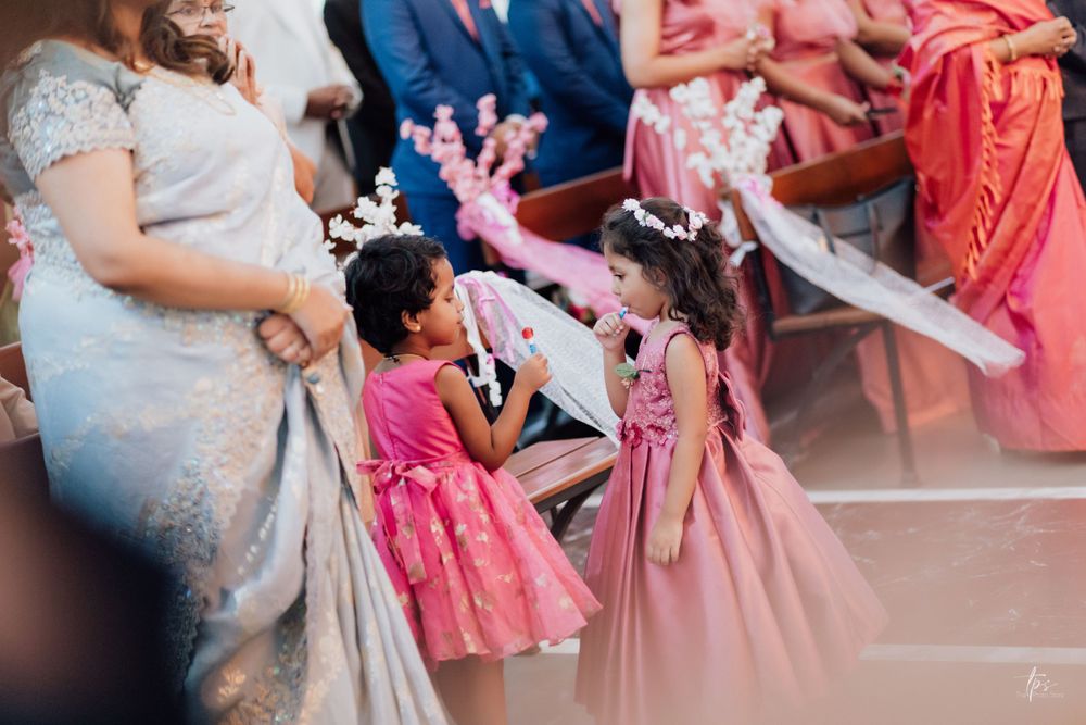 Wedding guests in colorful attire seated during ceremony celebration.