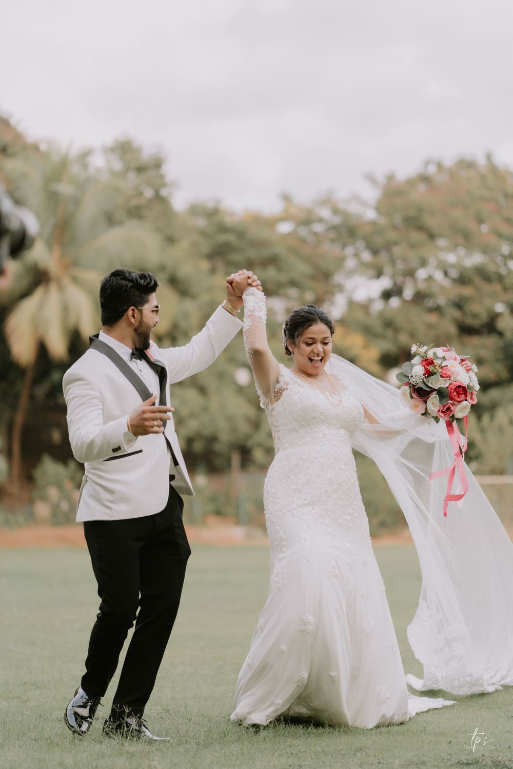 Playful wedding dance sequence on grass showing couple's joyful movements.