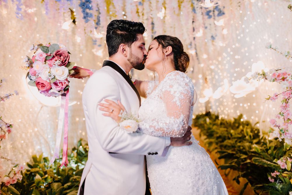 Intimate wedding scene with decorative floral arrangements and soft lighting creating a dreamy atmosphere.