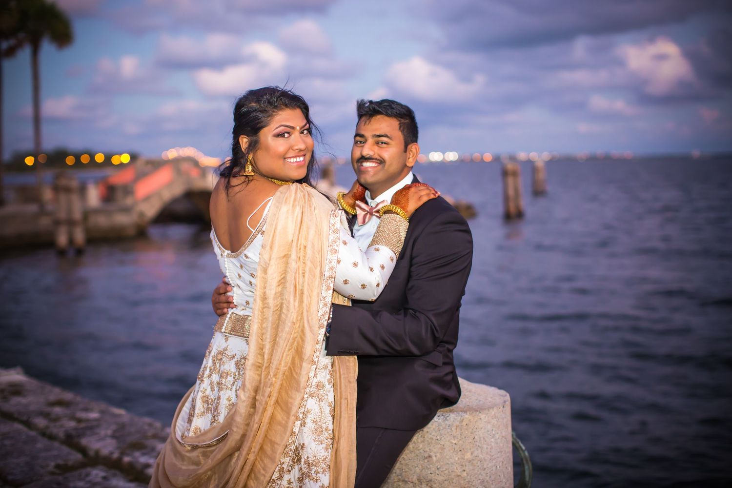 Indian couple posing on pier