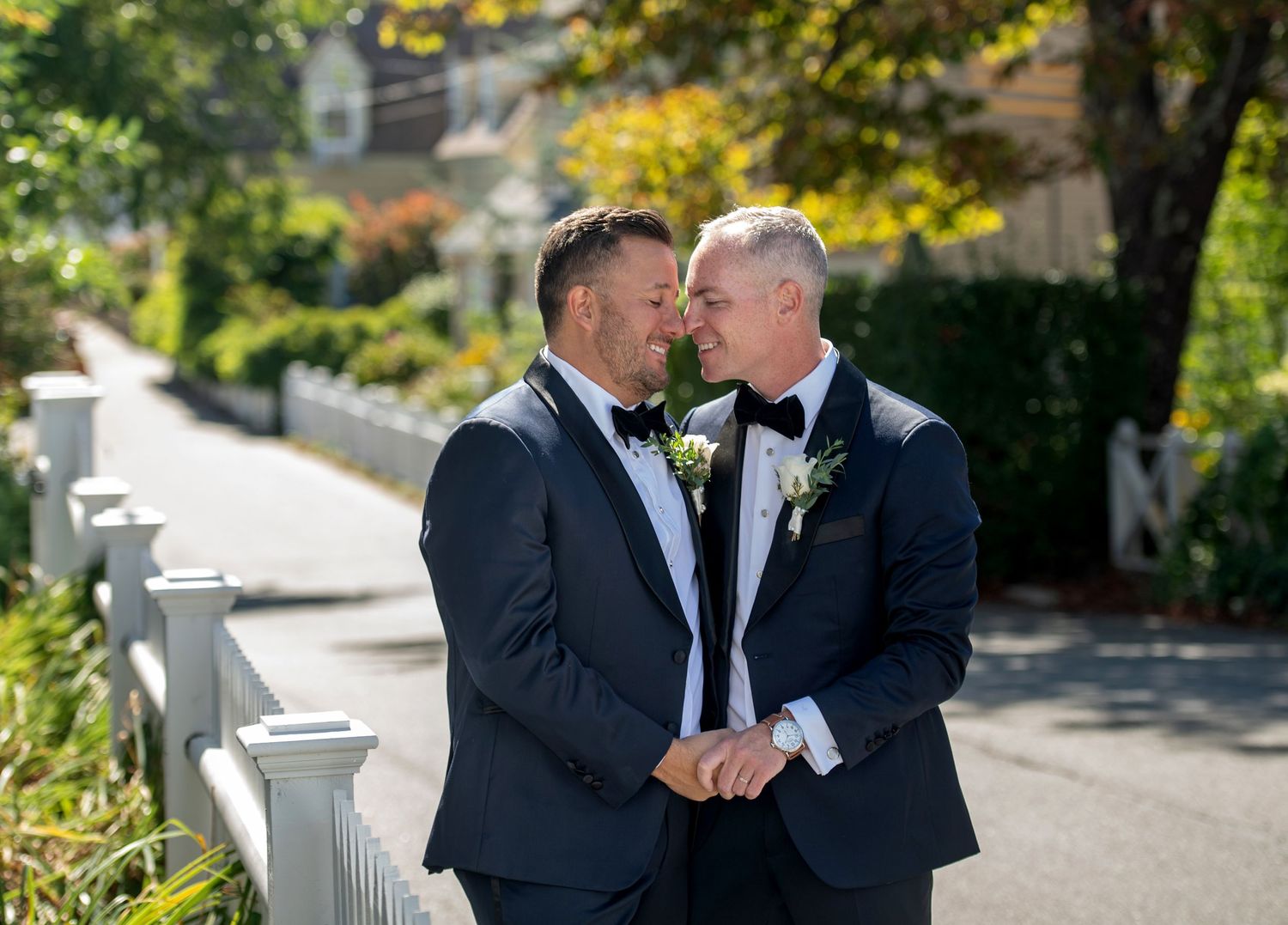 Elegant outdoor wedding photos being taken on a sunny autumn day.