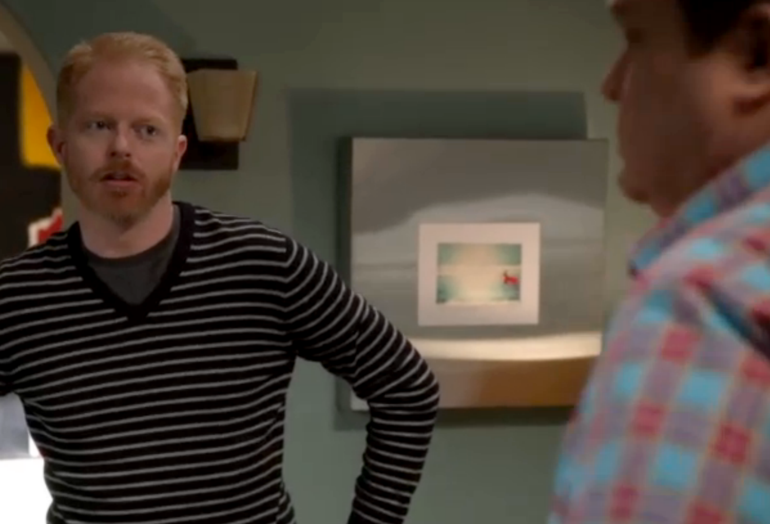 Surfer photo as set decor on Modern Family