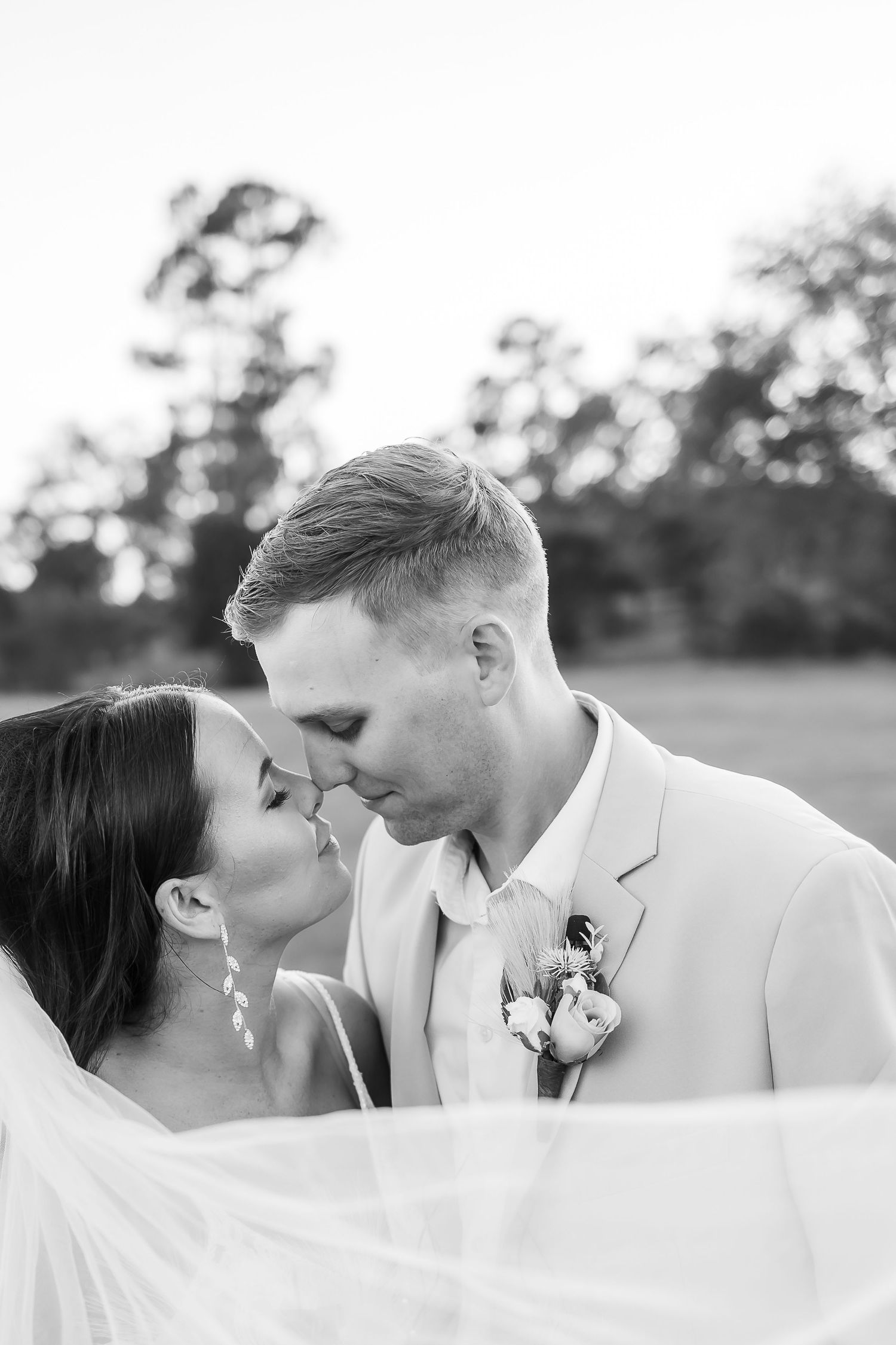 Romantic black and white wedding portrait sequence showing tender moments between newlyweds.