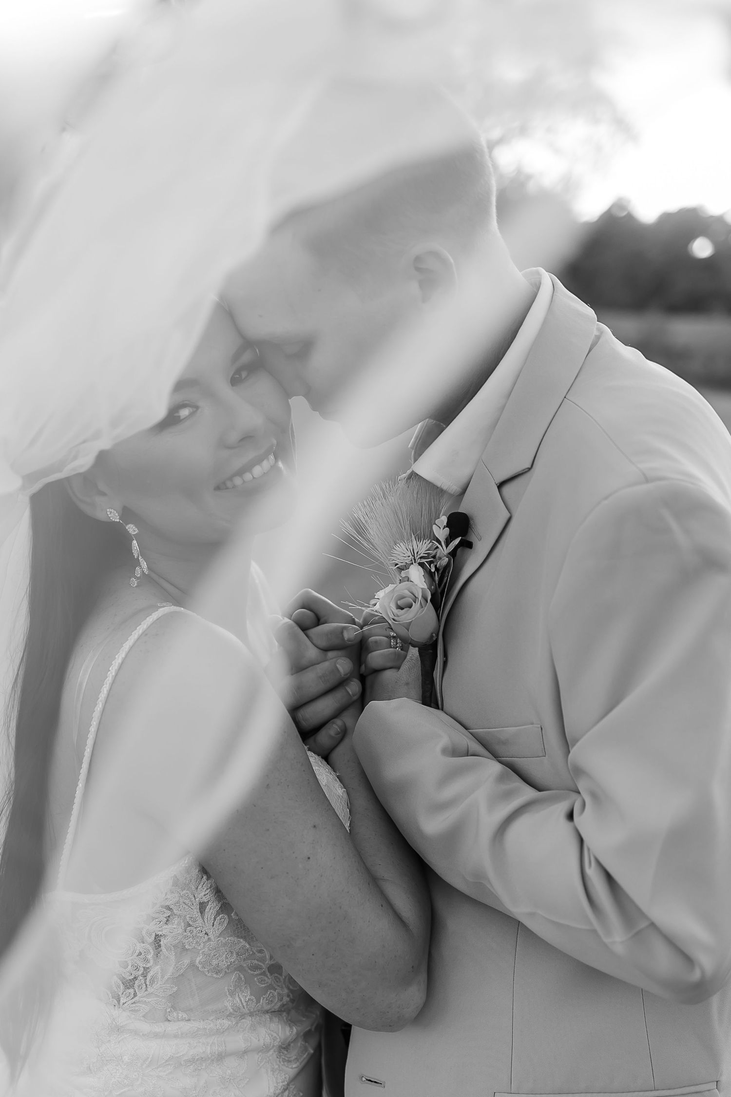 Artistic black and white close-up shots of tender wedding moments.