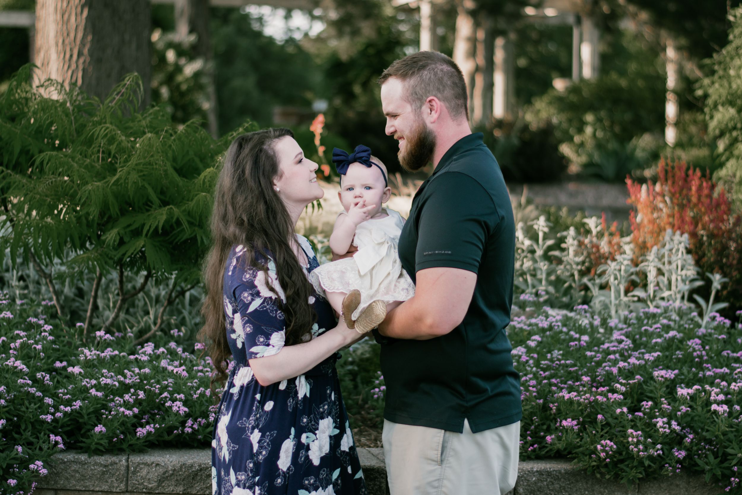 A touching family photo with a darling baby girl