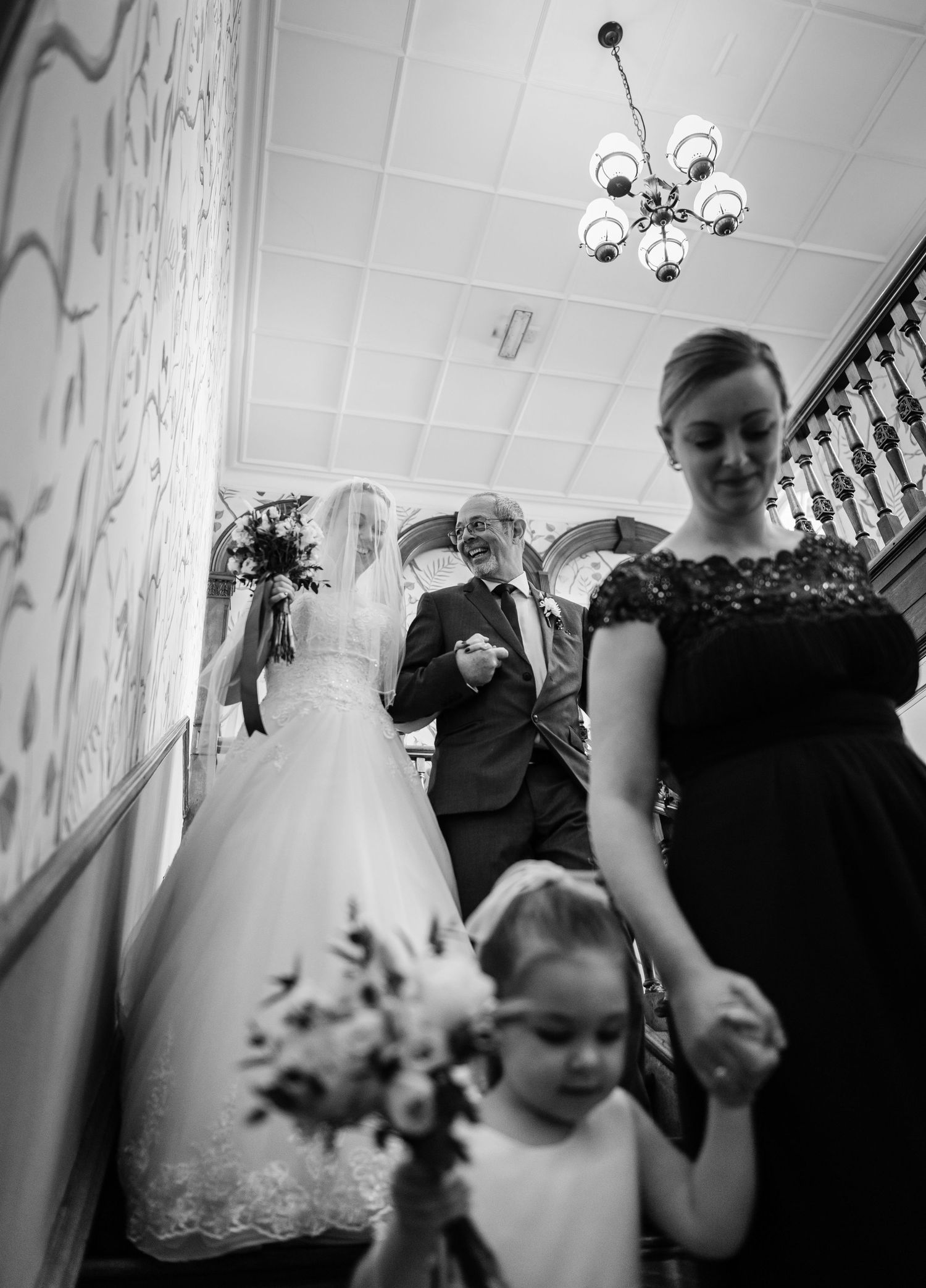 Bride walking with father to ceremony.