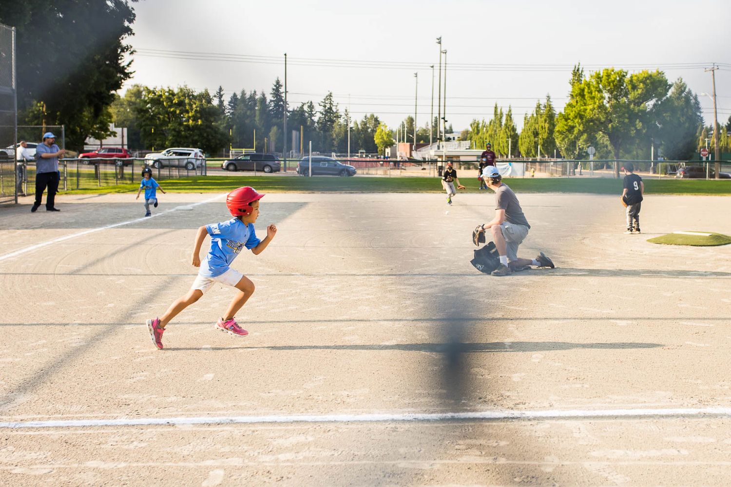 Ellie playing a baseball game in Redmond