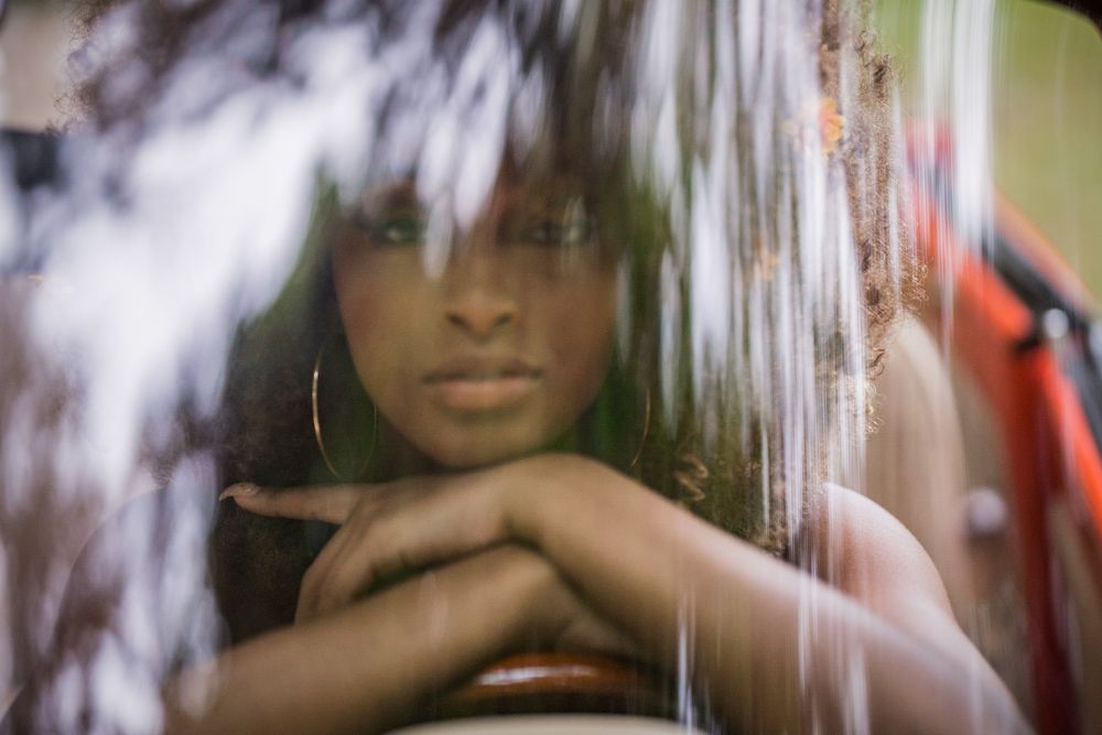 Artistic double exposure portrait with creative lighting effects and soft focus.