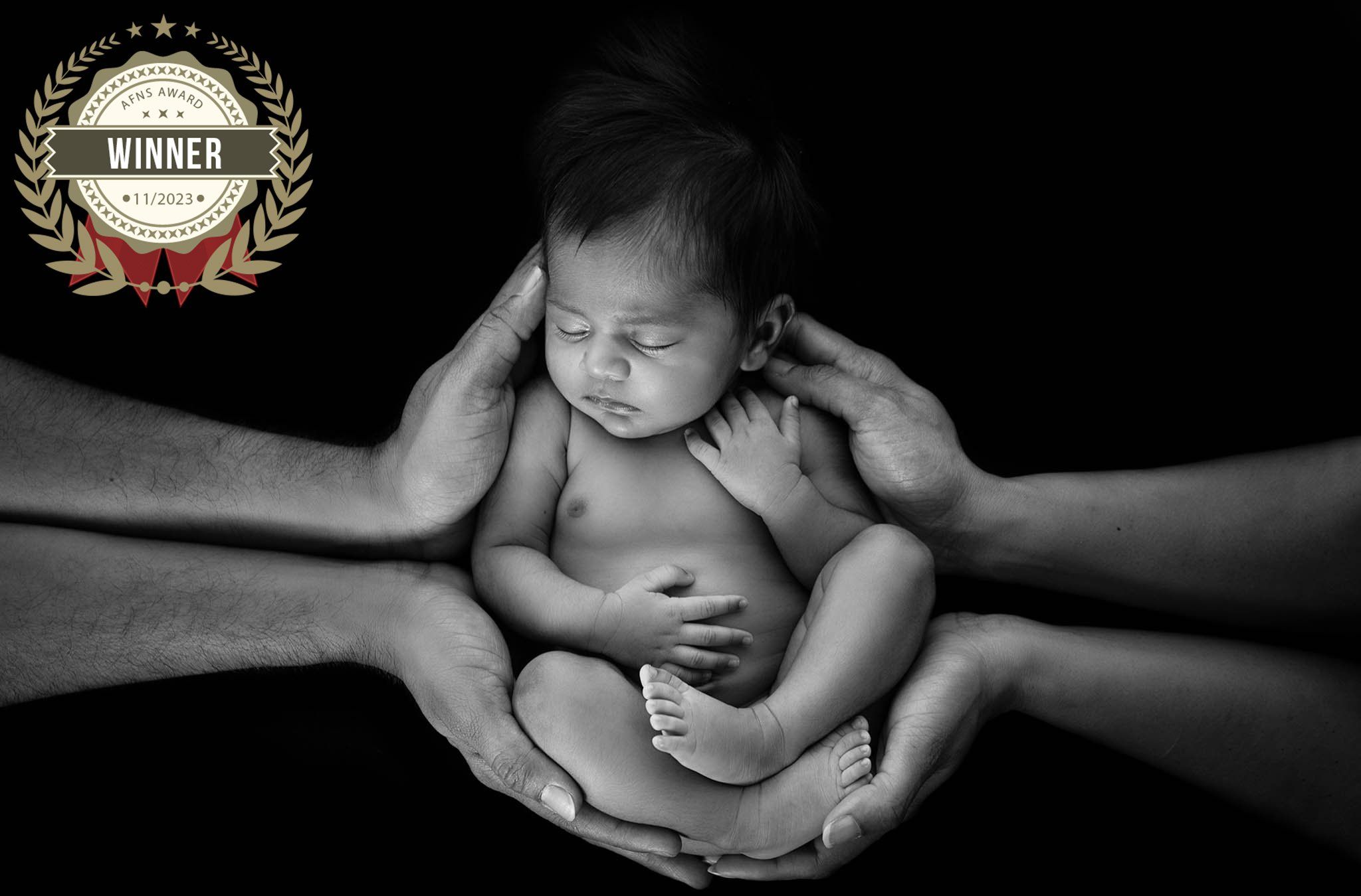 First-time parents with newborn baby in a luxury Gold Coast photography studio.