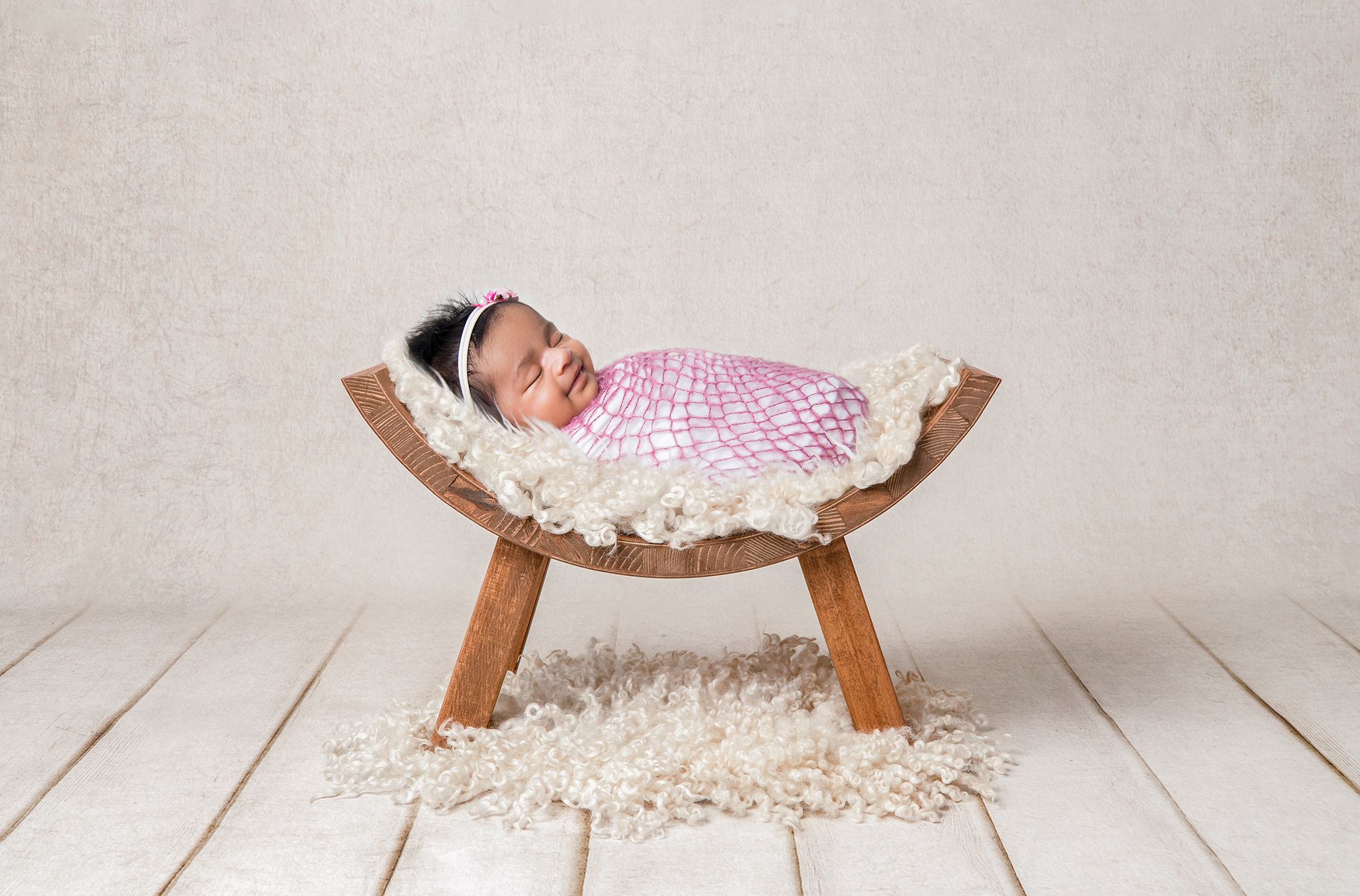 High-end baby portraiture focusing on the first days of a new legacy.