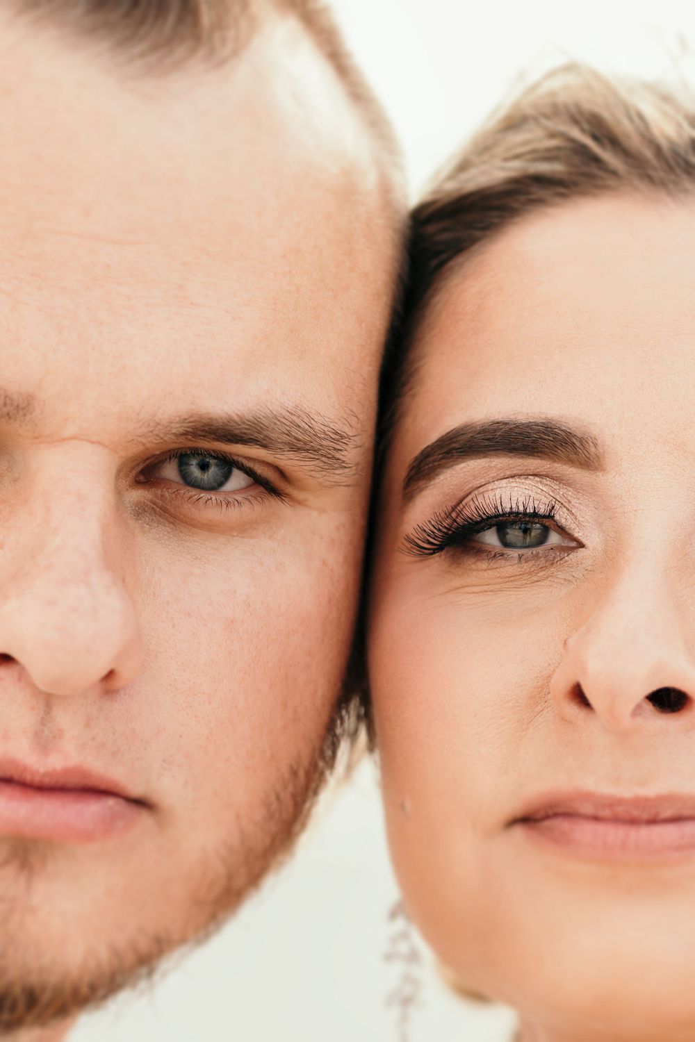 Close-up portrait showing blue eyes and soft expressions in an intimate wedding photo.