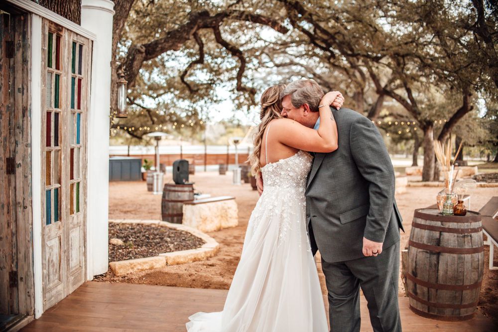 Rustic wedding venue with wooden barrels and stained glass windows.
