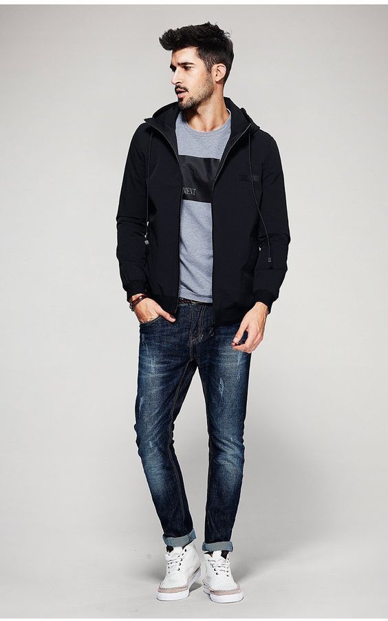 Urban men's fashion look featuring black zip hoodie, gray t-shirt and dark wash jeans.