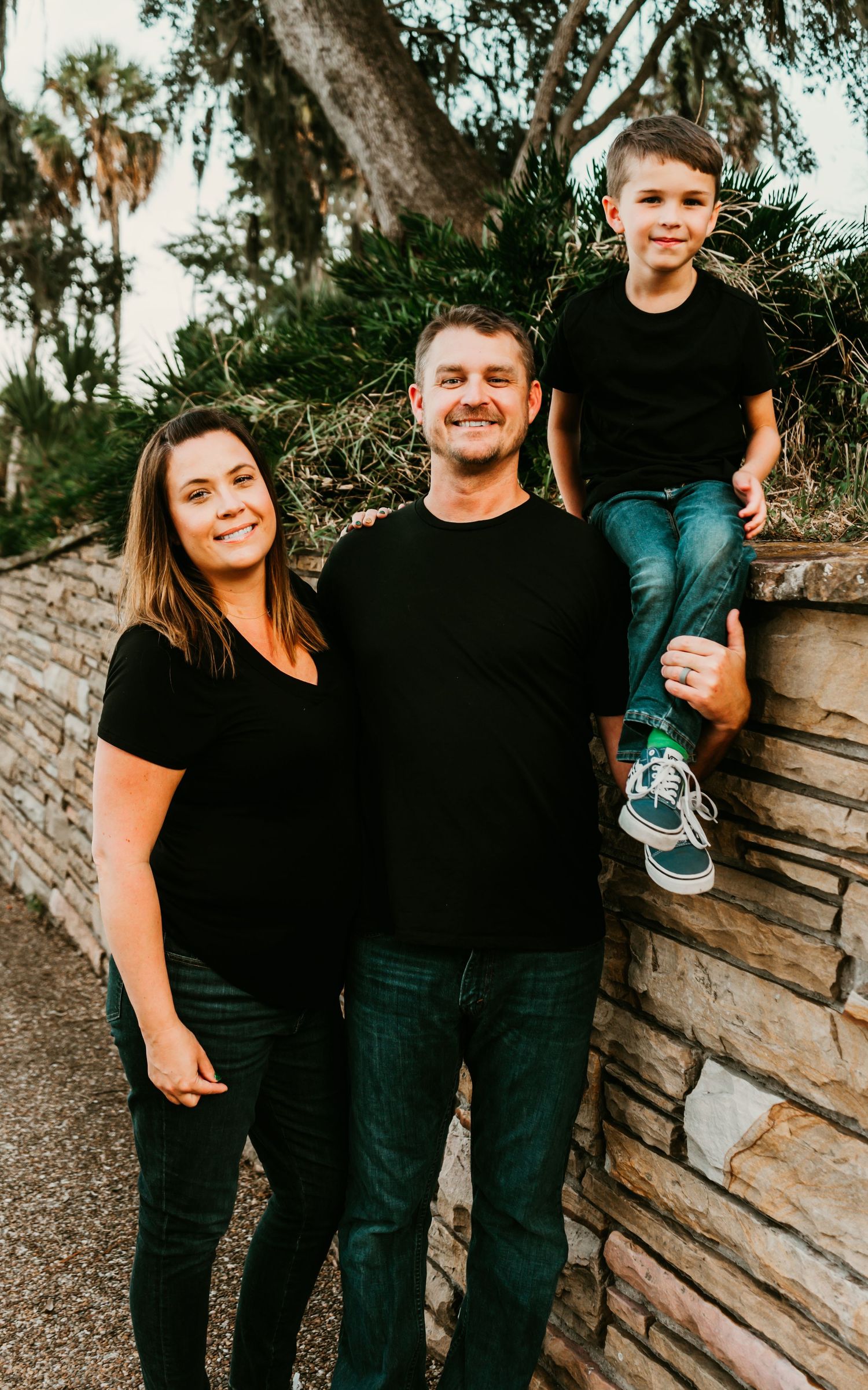 Outdoor Family Session Philippe Park in Safety Harbor, FL; Family posing against stone wall
