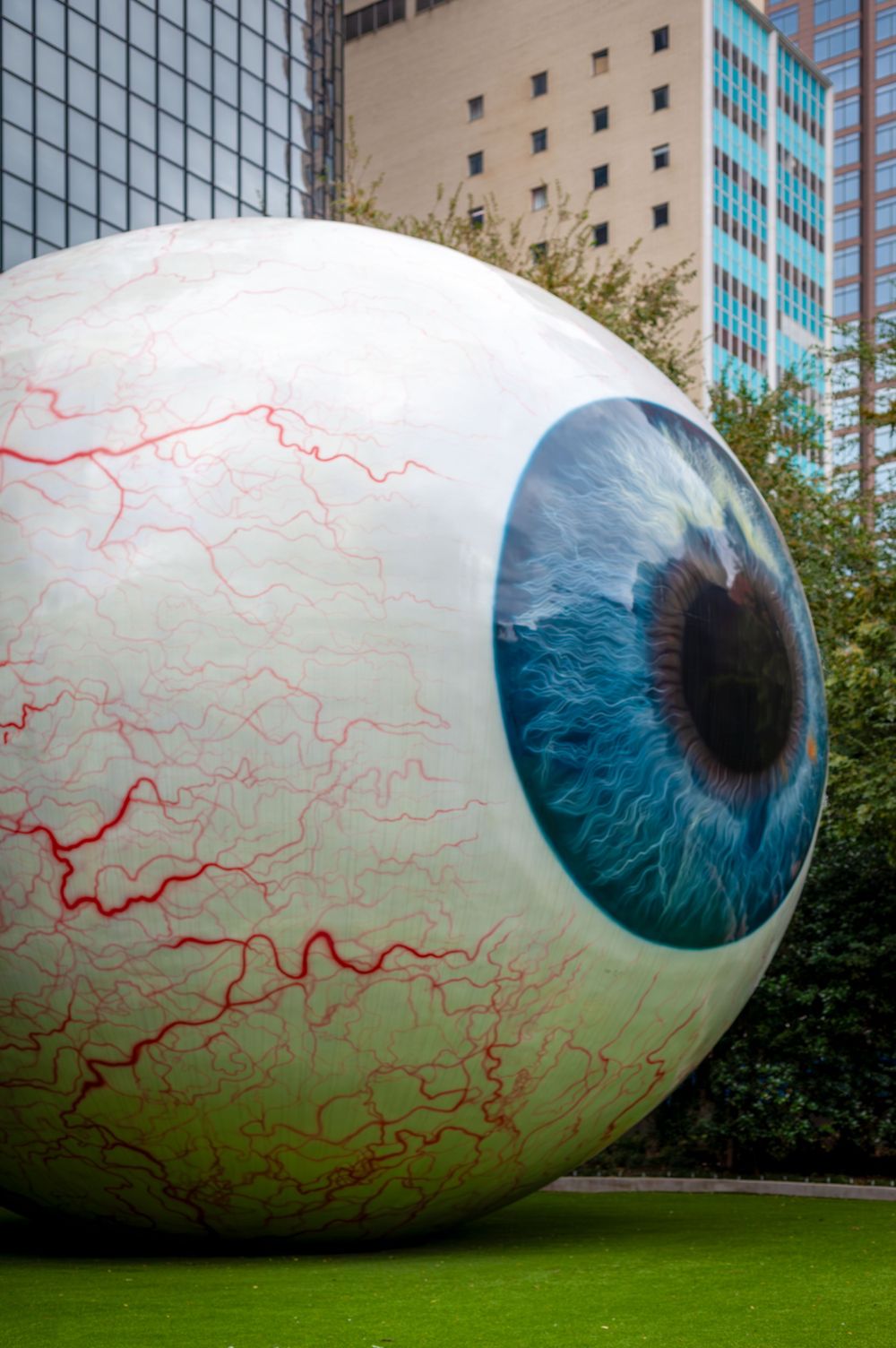"Eye" sculpture sitting among the skyscrapers in downtown Dallas, Texas