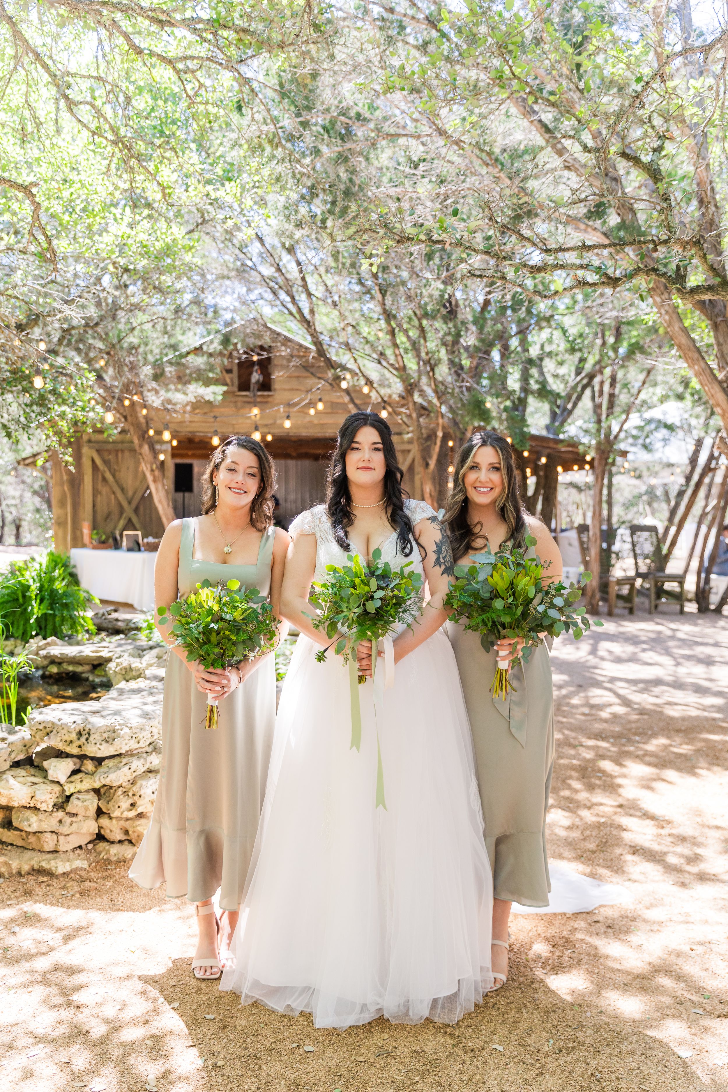 bridal party in front of barn at The Wildflower Barn