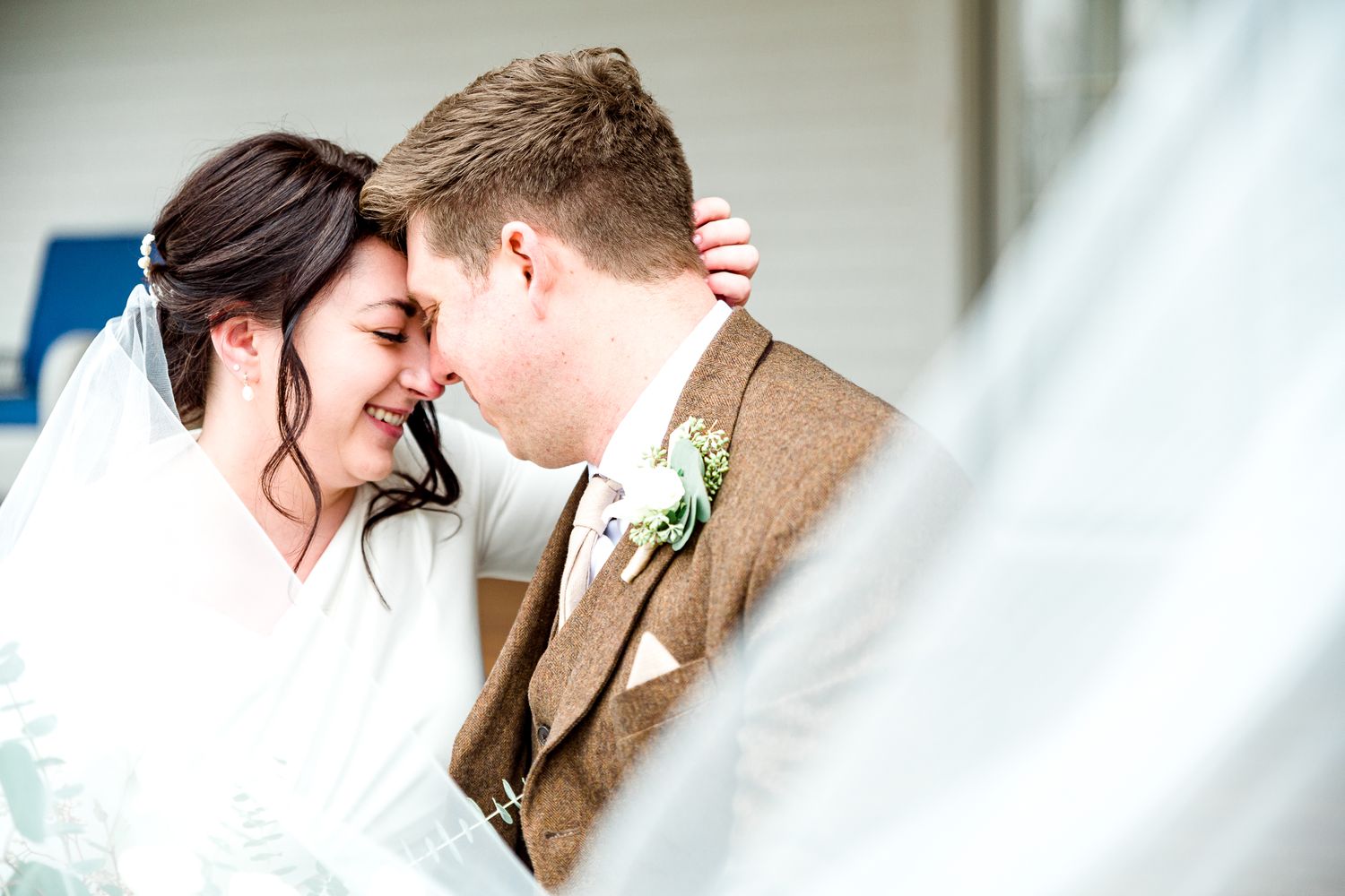 Intimate wedding portrait showing tender moment between newlyweds by Stephanie Coulter Photography