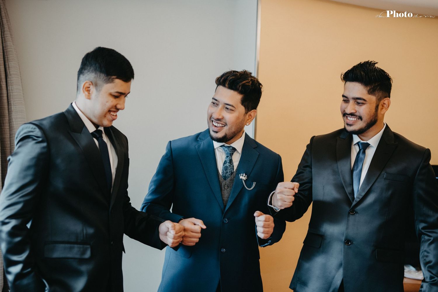Group of formally dressed people sharing laughs and candid moments.