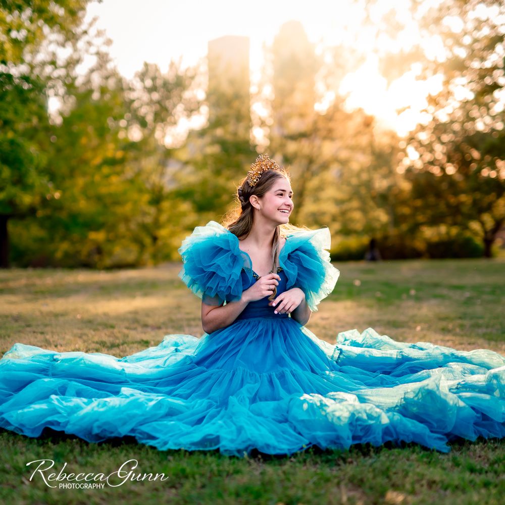 Teen wearing blue couture dress and gold crown in Tulsa Oklahoma