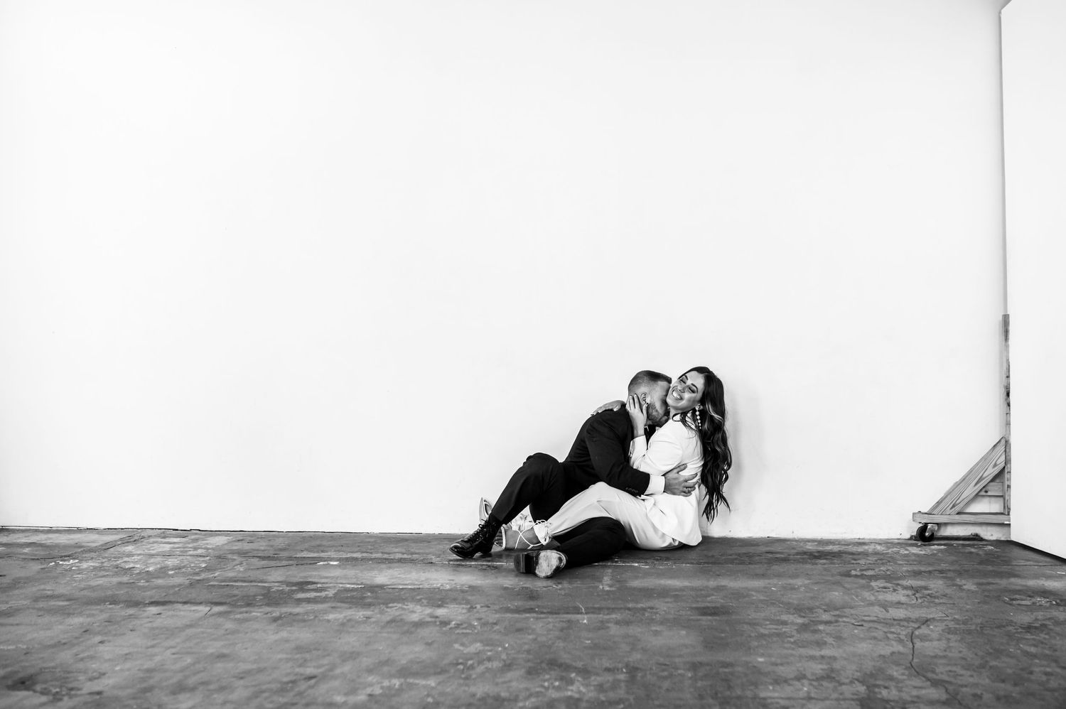Engaged man and woman in Houston photography studio.